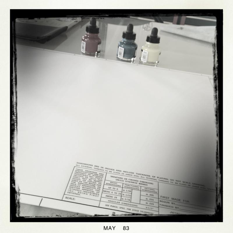 three ink bottles and vellum sheets